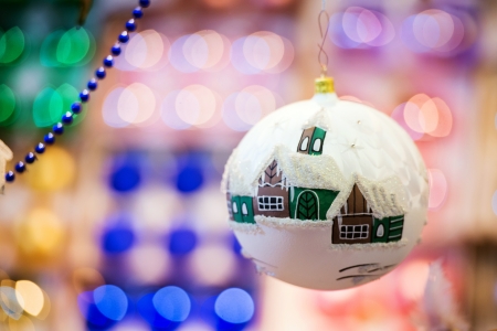 Painted Christmas ball with colorful lights in の写真素材