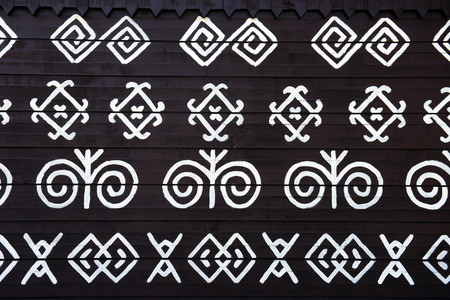 painted pattern on side of log house in Cicmany, UNESCO World Heritage Site, Slovakiaのeditorial素材