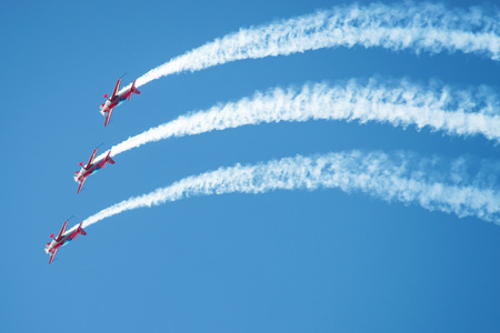 PAYERNE, SWITZERLAND - SEPTEMBER 6: Flight of Royal Jordanian Falcons aerobatic team in close formation on AIR14 airshow in Payerne, Switzerland on September 6, 2014のeditorial素材