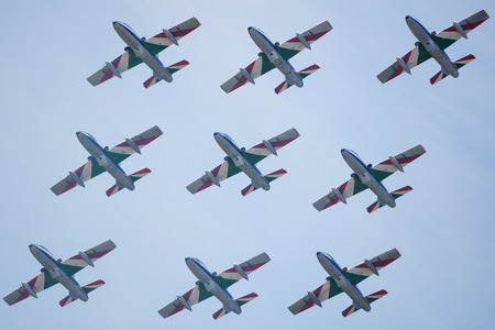 SLIAC, SLOVAKIA - AUGUST 30: Flight in close formation of Italian aerobatic team Frecce Tricolori at SIAF airshow in Sliac, Slovakia on August 30, 2015のeditorial素材