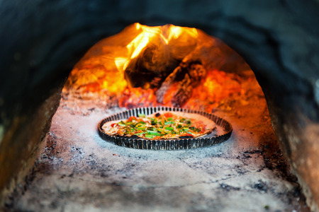 Baking of pizza in ovenの写真素材
