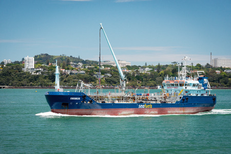 AUCKLAND, NEW ZEALAND - NOV 8 2015: Seafuel tanker Awanuia sailing on bay. Seafuel provides refuelling vessel service for cruise ships, commercial and container ships calling at the Port of Aucklandのeditorial素材