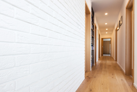 white brick wall in hallwayの写真素材