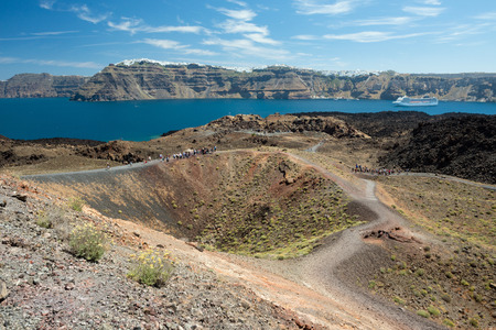 Volcanic island Nea Kameni, Santorini in background, Greeceの写真素材