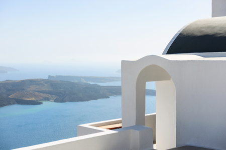 Santorini architecture with volcano island and Aegean sea in the background, Greeceの写真素材