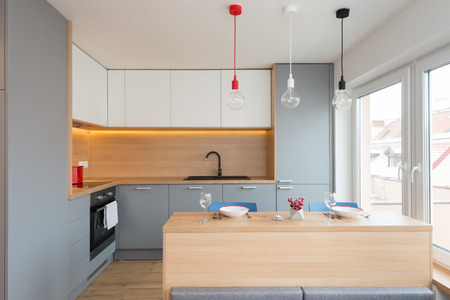 BRATISLAVA, SLOVAKIA - DEC 17, 2018: Kitchen area of small apartment designed by young interior...