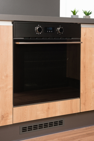New electric stove with induction cooktop in contemporary kitchenの写真素材
