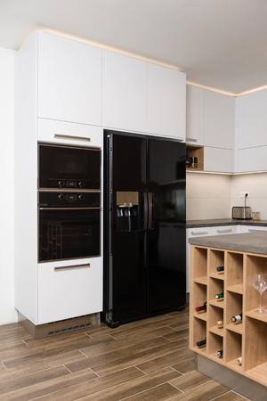 Interior of modern kitchen with built-in appliancesの写真素材