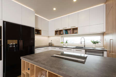 Interior of modern kitchen with built-in appliances