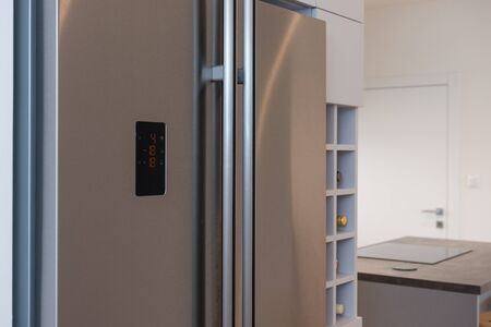 Interior of contemporary kitchen with built-in fridgeの写真素材