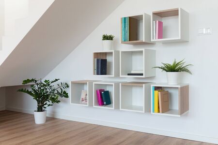 Contemporary living room interior with a shelf for books and accessoriesの写真素材