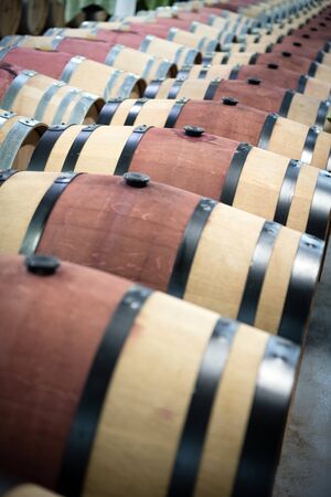 Wooden wine barrels for storage in wine cellar
