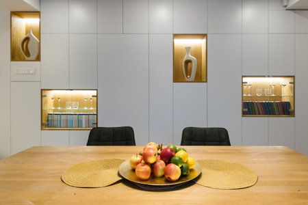 Dining table with fruit basket in modern house