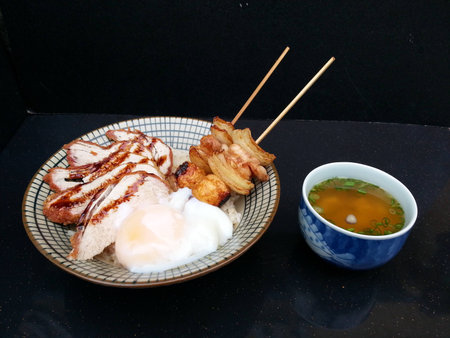 Pork Chop Kushi Don sushi on black backgroundの写真素材