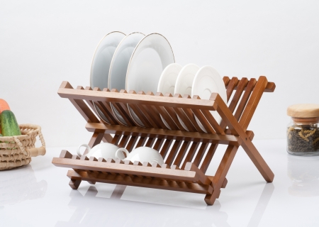 A small wooden shelf for keeping dishes and cups