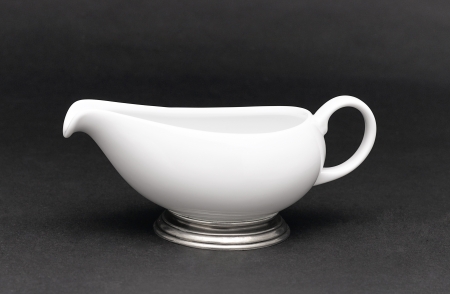 A porcelain pitcher for milk , tea or coffee decorated by pewterの写真素材