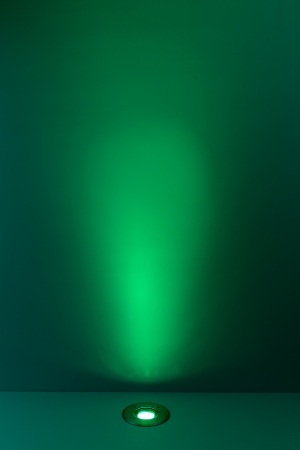 Green color background with lighting bulb の写真素材