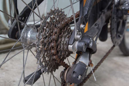 Close up of dirty bicycle rear gear and rusty chainの写真素材