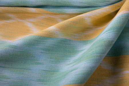 Close up of texture of hand woven cotton cloth, Thai cotton natural colour dyed