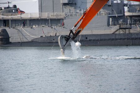 Crane cleaning the sea. Ship. Helicopter. Writing area. Background. Wallpaper.
