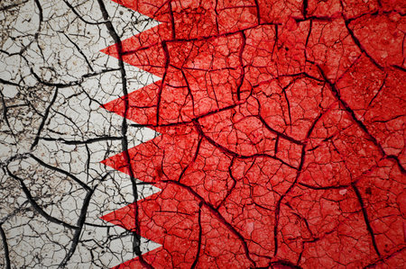 Dry soil pattern on the flag of Bahrain. Country with drought concept. water problem. Dry cracked earth country.の写真素材