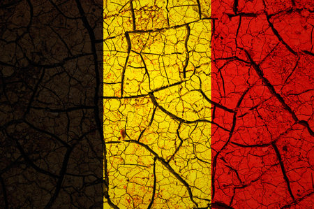 Dry soil pattern on the flag of Belgium. Country with drought concept. water problem. Dry cracked earth country.の写真素材