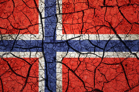 Dry soil pattern on the flag of Norway. Country with drought concept. water problem. Dry cracked earth country.の写真素材