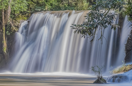 Waterfall surrounded by forest. Waterfall river.の写真素材