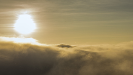 View of mountains, winter landscape with foggy hills at sunrise.の写真素材