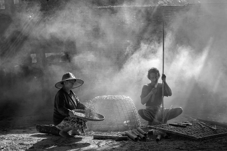 Fishermen fishing at sunset,Fishermen in Thailand.の写真素材