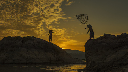 Asian boy fishing in the river .の写真素材