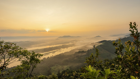 View of mountains, winter landscape with foggy hills at sunrise.の写真素材