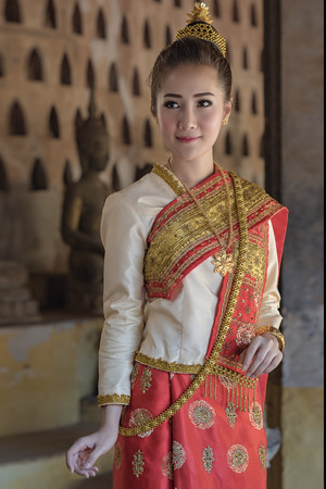 Beautiful girl in Laos costume.Lao traditional dress of a beautiful woman.の写真素材