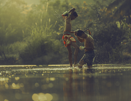 Thai boxing at the river.Boxing and fighting to protect.の写真素材