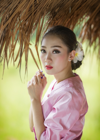 Beautiful Laos girl in Thai traditional costume.の写真素材