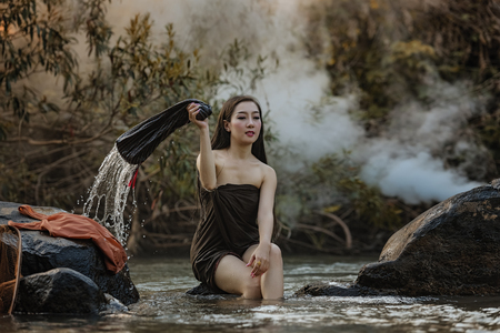 beautiful happy Asian girl smile and laugh together,Image with sunlight filter,の写真素材
