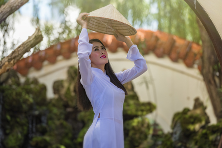 Ao dai is famous traditional costume for woman in VIetnam.の写真素材