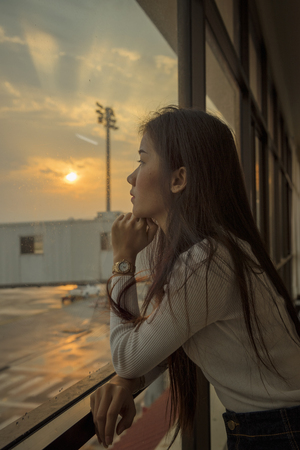 Airport terminal, people going to airplane ,travel concept, people in the airport,woman carries luggage at the airport terminal,の写真素材