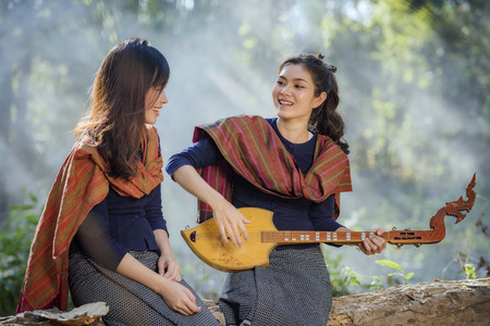 country girl portrait in outdoors,beautiful happy Asian girl smile and laugh together.の写真素材