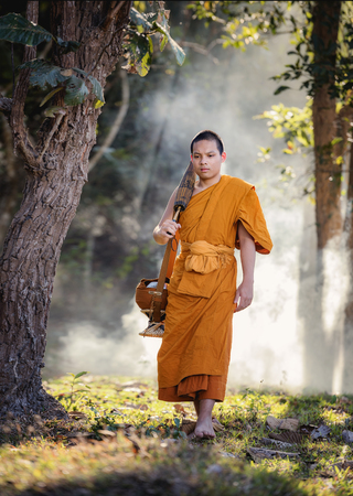 Novice pilgrimage to the forest alone,Novice monk went on a pilgrimage alone.の写真素材