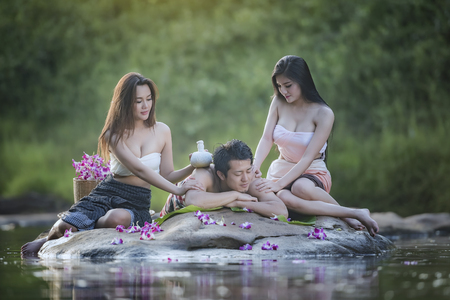 people relaxed in the nature spa,body care, Spa body massage treatment, people having massage in the nature.の写真素材