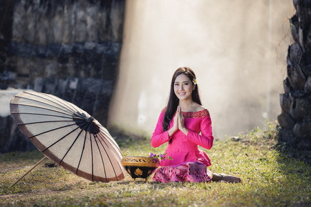 Beautiful Laos girl in Laos costume,Asian woman wearing traditional Laos culture,vintage style,Laos traditional suit,Laos vintage style,Laos dress,Laos,Lao traditional dress of a beautiful woman.の写真素材
