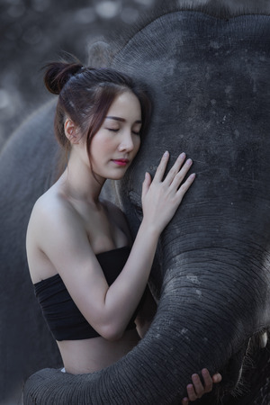 Thailand shows playing with an elephant ,Thai woman with elephant.の写真素材