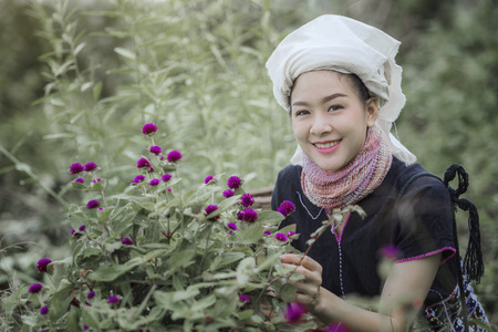 tribes on the mountain and fog in the morning,tribe  in beautiful costume dress,tribe in traditional uniform play on the swings is covered with fog,Traditional tribal culture.の写真素材