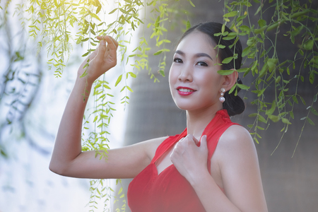 Asian woman with Chinese traditional dress ,Chinese new year concept.の写真素材