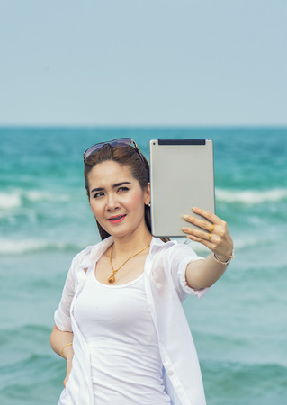 Selfie girl at the beach.の写真素材