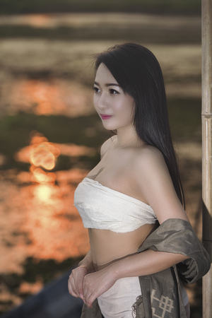 A portrait of a beautiful asian woman smiling brightly at the camera,beautiful happy Asian girl smile and laugh together.の写真素材