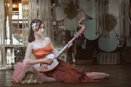 Thailand traditional dress,Beautiful Thai girl in traditional dress costume,woman wearing typical Thai dress,identity culture of thailand.の写真素材