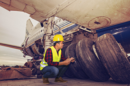 Old aircraft engine,Inside airplane wreckage,Airline safety engineer going through a pre-flight checklist by Flight engineer,useful for plane safety, pilot, flights, air craft.の写真素材