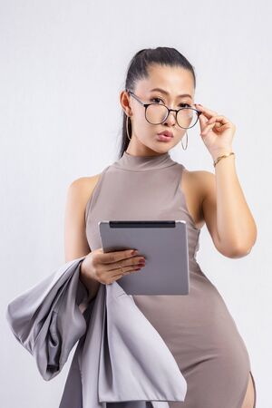 Working woman,Portrait of a beautiful young girl working in the office,Beautiful smiling businesswoman on white background.Business woman with isolated or white background.の写真素材